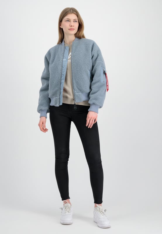 This is the MA-1 VF Teddy bomber jacket from Alpha Industries. The high-gloss zippers and oversized fit are both stylish and comfortable, while the sleeve pocket adds a practical element.