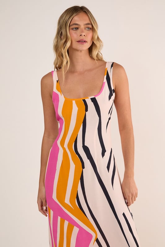 Striking abstract painted stripe pattern for a bold statement piece
        Flattering scoop neckline that frames the dcolletage beautifully
        Flowing maxi length with a relaxed silhouette for effortless movement
        Lightweight viscose Morrocain fabric that drapes elegantly against the body
        Versatile sleeveless design with thin straps perfect for warmer weather
    
    Make a splash at your next daytime gathering in this eye-catching Abstract Painted Stripe Scoop Neck Maxi Dress from Nasty Gal. The artistic stripe pattern creates visual interest whilst the fluid viscose Morrocain fabric ensures a comfortable fit that moves gracefully with every step. Style with simple flip flops as seen on our model for casual brunches, or dress it up with strappy sandals and a denim jacket for family barbecues. The versatile scoop neckline works brilliantly with delicate layered necklaces, while the maxi length offers a relaxed yet put-together look. This dress transitions seamlessly from weekend shopping trips to alfresco dining, making it an essential addition to your warm-weather wardrobe that will turn heads for all the right reasons.