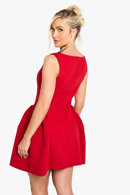 Striking Volumen skater dress with a flattering structured silhouette
        Sleeveless design with a chic slash neckline for a contemporary look
        Distinctive side pleats create dramatic volume and movement
        Short length perfect for showcasing your legs
        Clean, minimalist design makes it ideal for accessorising to suit your style
    
    Make a bold statement in this eye-catching Volumen skater dress from Boohoo. The architectural silhouette features dramatic side pleats that create stunning volume and movement as you walk, dance, or simply turn heads at your next night out. Style with strappy heels as shown for a classic going-out ensemble, or customise with statement jewellery to reflect your personal flair. This versatile piece transitions effortlessly from drinks with the girls to club nights in the city. The sleeveless cut and slash neckline offer a modern, fresh aesthetic while maintaining a sophisticated edge. Complete your look with a compact handbag and sleek updo for a night of urban adventures where you'll radiate confidence and style.