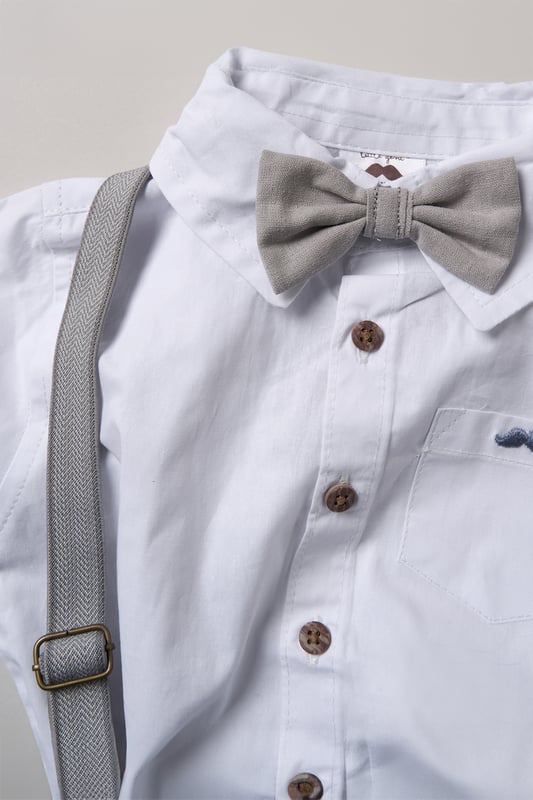 Dress your little one to impress with this delightful set from Little Gent. Featuring a shirt, bowtie, and shorts with attached braces. Perfect for special occasions or stylish outings, your little one will look effortlessly dapper and be ready to steal the spotlight!