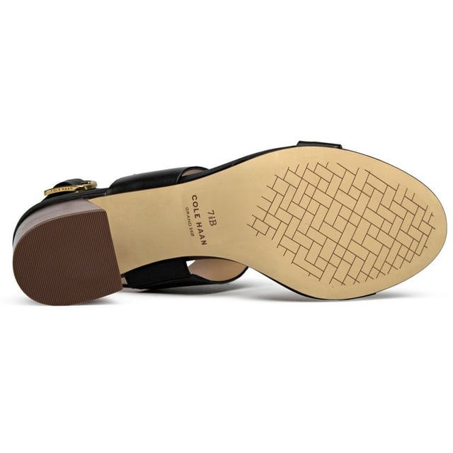 The Cole Haan Josie T-Strap elevates summer sophistication with its sleek black leather construction and striking wood-trimmed sole. At 7cm, the wedge heel delivers confident height while the cushioned insole ensures all-day comfort. The classic T-strap silhouette secured with a refined buckle closure makes this sandal an effortless transition from boardroom to bistro.