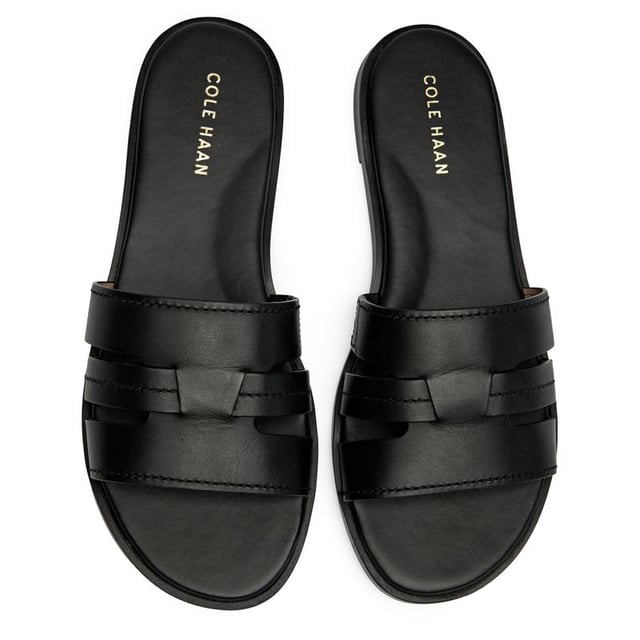 Sandalias negras Cole Haan Flynn para mujer, fabricadas en piel y suela sintética. Incluyen: parte superior de piel y plantilla acolchada.