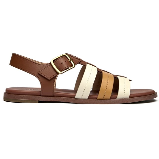 Effortless sophistication meets everyday comfort in these tan leather slides. The Cole Haan Flynn Fishman features a supple leather upper with a classic buckle detail that adds just the right touch of refinement. With a cushioned insole that cradles your feet and a durable synthetic sole, these versatile flats transition seamlessly from morning errands to evening gatherings.