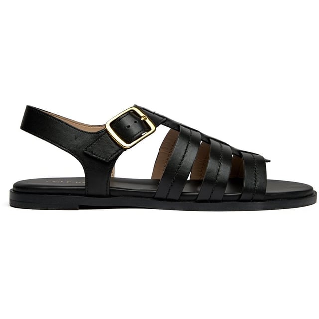 These sleek black leather slides bring effortless sophistication to your summer wardrobe. The Flynn Fisherman features premium leather construction with a comfortable cushioned insole that cradles your feet through long days. A classic buckle closure adds both style and adjustability, while the durable synthetic sole provides reliable traction. Perfect for everything from weekend brunches to casual office days.