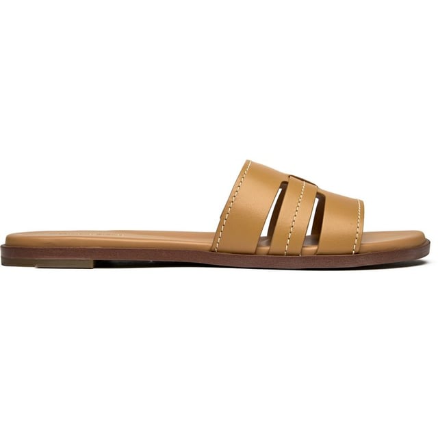 The Cole Haan Flynn slides bring effortless sophistication to your warm-weather wardrobe. Crafted with buttery leather uppers in a versatile tan shade, these flats transition seamlessly from poolside lounging to city strolling. The cushioned insole ensures all-day comfort whether you're running errands or meeting friends for brunch. Clean lines and premium materials make these slides a refined choice that pairs beautifully with everything from sundresses to tailored shorts.