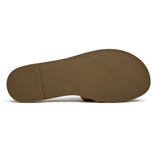 The Cole Haan Flynn slides bring effortless sophistication to your warm-weather wardrobe. Crafted with buttery leather uppers in a versatile tan shade, these flats transition seamlessly from poolside lounging to city strolling. The cushioned insole ensures all-day comfort whether you're running errands or meeting friends for brunch. Clean lines and premium materials make these slides a refined choice that pairs beautifully with everything from sundresses to tailored shorts.