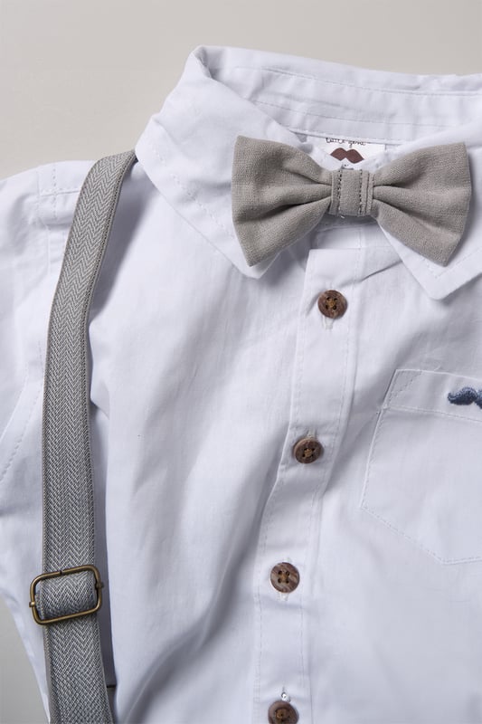 Dress your little one to impress with this delightful set from Little Gent. Featuring a shirt bodysuit, bowtie, and shorts with attached braces. Perfect for special occasions or stylish outings, your little one will look effortlessly dapper and be ready to steal the spotlight!
