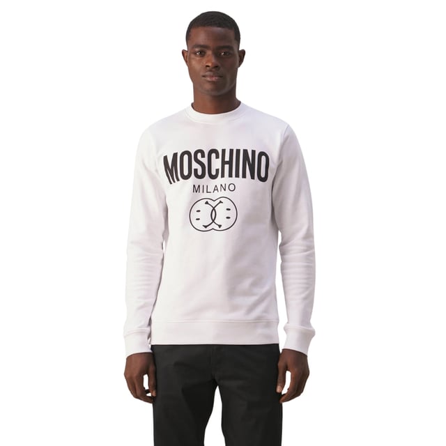 Elevate your wardrobe with the Moschino Double Smiley White Jumper, a perfect blend of playful design and premium comfort. Crafted from soft, high-quality fabric, this jumper features Moschino's iconic double smiley graphic that adds a fun, contemporary edge to your look. Its crisp white color makes it versatile for any casual occasion, while the relaxed fit ensures all-day comfort. Whether paired with jeans or layered under a jacket, this jumper effortlessly combines style and ease, making it a must-have statement piece for those who appreciate bold fashion with a lighthearted twist.1001 WHITE JUMPER MALE, Made in Portugal, 100% Cotton