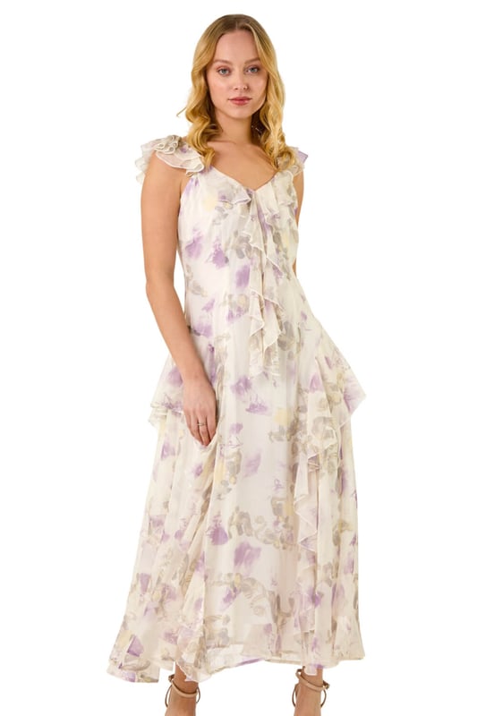 Dusk Floral Print Ruffle Maxi Dress from Roman. Make a stunning entrance this Spring Summer season in this floral print maxi dress. Embrace your feminine side with the v-neckline and flutter sleeves adorned with delicate ruffle detailing. The blooming floral print adds a touch of romance, while the comfortable woven chiffon fabric ensures a flattering flowy silhouette at maxi length. Complete the look with a bolero and heels for any special occasion!