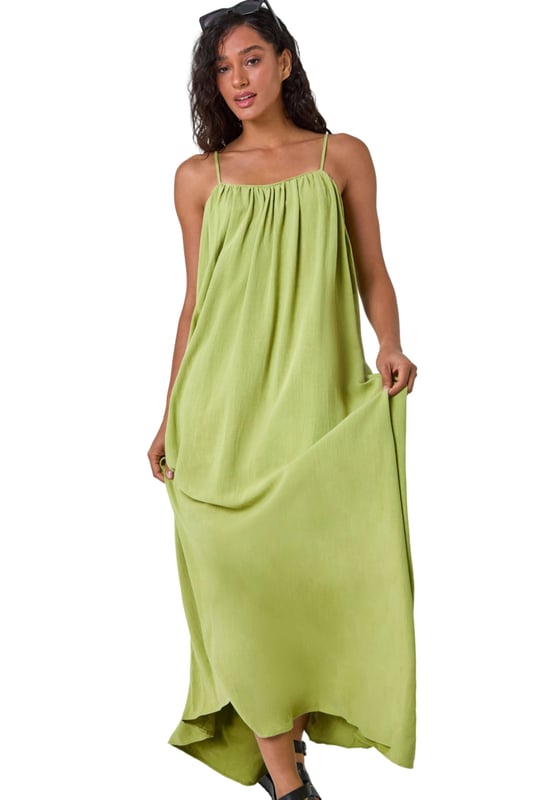 Dusk Woven Strappy Maxi Dress from Roman. Float effortlessly through the Spring Summer season in our trendy strappy maxi dress. Falling to a comfortable maxi length, this dress features a flowy A-line shape and sleeveless silhouette. Cut from a smooth woven fabric with a touch of linen, it will keep you airy and light. Perfect for your beach getaway or casual days out, style this versatile dress with strappy sandals and a light jacket for a laid-back look!