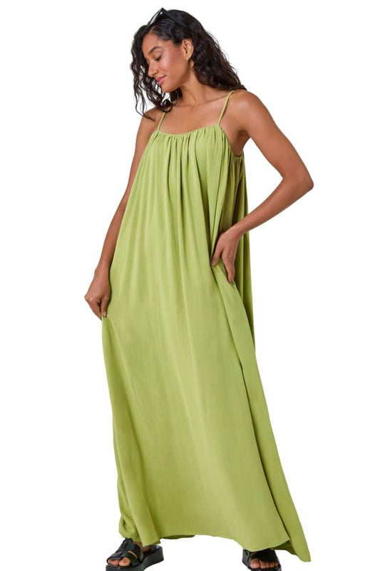 Dusk Woven Strappy Maxi Dress from Roman. Float effortlessly through the Spring Summer season in our trendy strappy maxi dress. Falling to a comfortable maxi length, this dress features a flowy A-line shape and sleeveless silhouette. Cut from a smooth woven fabric with a touch of linen, it will keep you airy and light. Perfect for your beach getaway or casual days out, style this versatile dress with strappy sandals and a light jacket for a laid-back look!