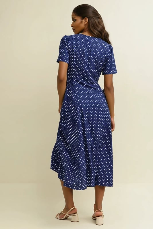 The Ellen tea dress is made entirely from responsible viscose that drapes like a dream. A little bit vintage-inspired. A navy polka dot print, swishy a-line cut and delicate line of buttons add to the look. Finish yours with gold necklaces.
 These are very slight seconds - does not affect wearability.

48-49" Shoulder to Hem.

As clearance stock they may not be in original packaging.