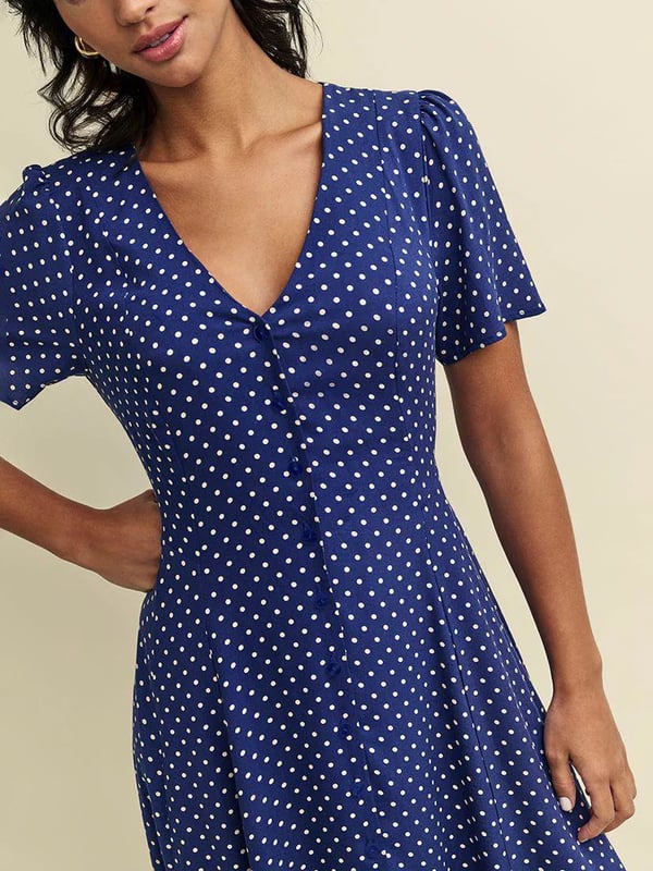The Ellen tea dress is made entirely from responsible viscose that drapes like a dream. A little bit vintage-inspired. A navy polka dot print, swishy a-line cut and delicate line of buttons add to the look. Finish yours with gold necklaces.
 These are very slight seconds - does not affect wearability.

48-49" Shoulder to Hem.

As clearance stock they may not be in original packaging.