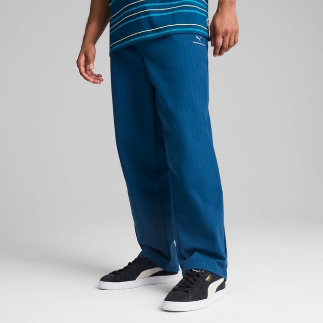 PRODUCT STORY: Celebrate your Cityzen pride with these refined pants. Featuring a sleek PUMA Cat logo, woven jacquard, and practical pockets, this MMQ piece embodies the "Macht's mit QualitÃ¤t" (Made with Quality) spirit. Minimalistic aesthetics and sophisticated details make it perfect for fans who appreciate minimalist design in the colors of the Sky Blues. FEATURES & BENEFITS: Made with at least 50% recycled materials. DETAILS: Relaxed fit; Dobby material; Regular length; Medium rise; Button placket; Back Pocket, Side Pocket, Other Pocket; PUMA branding details.