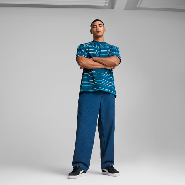 PRODUCT STORY: Celebrate your Cityzen pride with these refined pants. Featuring a sleek PUMA Cat logo, woven jacquard, and practical pockets, this MMQ piece embodies the "Macht's mit QualitÃ¤t" (Made with Quality) spirit. Minimalistic aesthetics and sophisticated details make it perfect for fans who appreciate minimalist design in the colors of the Sky Blues. FEATURES & BENEFITS: Made with at least 50% recycled materials. DETAILS: Relaxed fit; Dobby material; Regular length; Medium rise; Button placket; Back Pocket, Side Pocket, Other Pocket; PUMA branding details.
