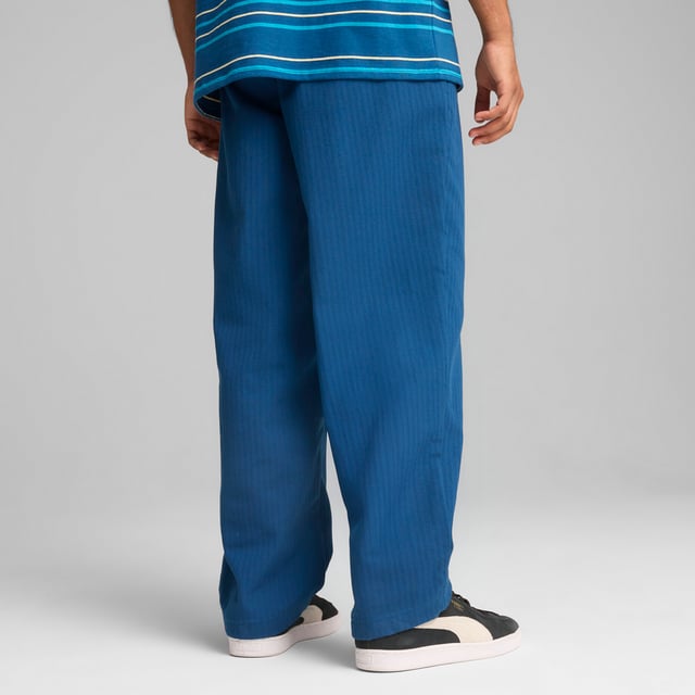 PRODUCT STORY: Celebrate your Cityzen pride with these refined pants. Featuring a sleek PUMA Cat logo, woven jacquard, and practical pockets, this MMQ piece embodies the "Macht's mit QualitÃ¤t" (Made with Quality) spirit. Minimalistic aesthetics and sophisticated details make it perfect for fans who appreciate minimalist design in the colors of the Sky Blues. FEATURES & BENEFITS: Made with at least 50% recycled materials. DETAILS: Relaxed fit; Dobby material; Regular length; Medium rise; Button placket; Back Pocket, Side Pocket, Other Pocket; PUMA branding details.