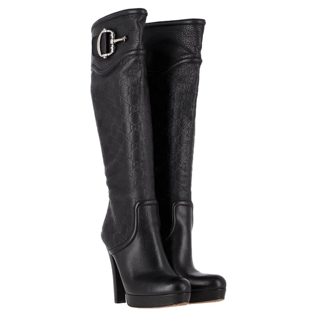 VINTAGE, RRP AS NEW
 Make a bold statement with the Gucci Guccissima Platform Knee-High Boots, crafted in sleek black leather and embossed with the iconic monogram. The dramatic platform and towering heel elevate any outfit—literally and stylistically—while exuding luxury from every angle. **Styling Tip:** Let the boots shine by pairing them with a fitted mini dress or leather skirt for an edgy, fashion-forward look.

Gucci Guccissima Platform Knee-High Boots in Black Leather

Condition: Very good
Signs of wear: Minor markings, Lightly used but very well maintained. Minor mark at soles & creasing, light scuffing at the soles and heels.
Packaging: None
Color: Black
Material: Leather | leather
Size: IT | 38.5
Measurements: Heel height: 120; Insole length: 270
SKU: NAPPUGBSH489764W