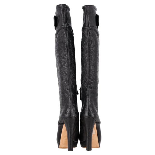 VINTAGE, RRP AS NEW
 Make a bold statement with the Gucci Guccissima Platform Knee-High Boots, crafted in sleek black leather and embossed with the iconic monogram. The dramatic platform and towering heel elevate any outfit—literally and stylistically—while exuding luxury from every angle. **Styling Tip:** Let the boots shine by pairing them with a fitted mini dress or leather skirt for an edgy, fashion-forward look.

Gucci Guccissima Platform Knee-High Boots in Black Leather

Condition: Very good
Signs of wear: Minor markings, Lightly used but very well maintained. Minor mark at soles & creasing, light scuffing at the soles and heels.
Packaging: None
Color: Black
Material: Leather | leather
Size: IT | 38.5
Measurements: Heel height: 120; Insole length: 270
SKU: NAPPUGBSH489764W