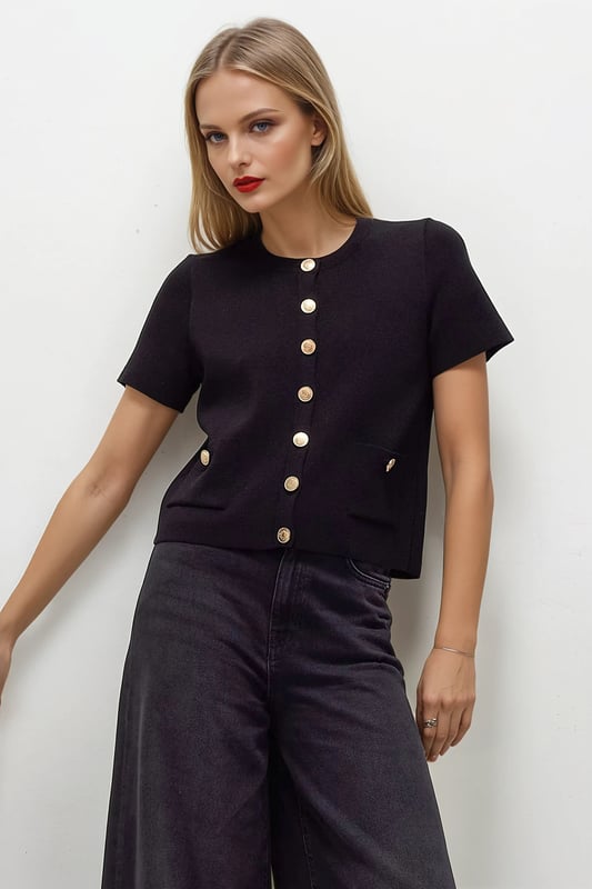 This short sleeve cardigan is crafted from a textured knit for a breezy feel, perfect for layering. Cut in a boxy fit, it features a crew neckline and a button-through front.

20" Shoulder to Hem.

As clearance stock, brand labels have been snipped.