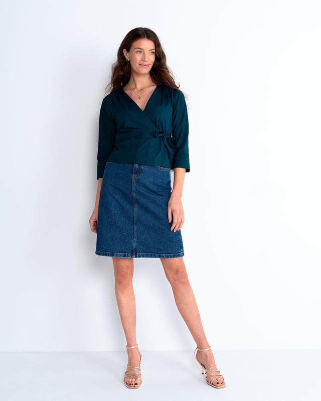 Embrace sophistication with this fitted wrap-style shirt, perfect for day-to-evening occasions. Featuring 3/4 length sleeves, pleated shoulders, cuffs, and adjustable side ties, it offers a flattering silhouette.