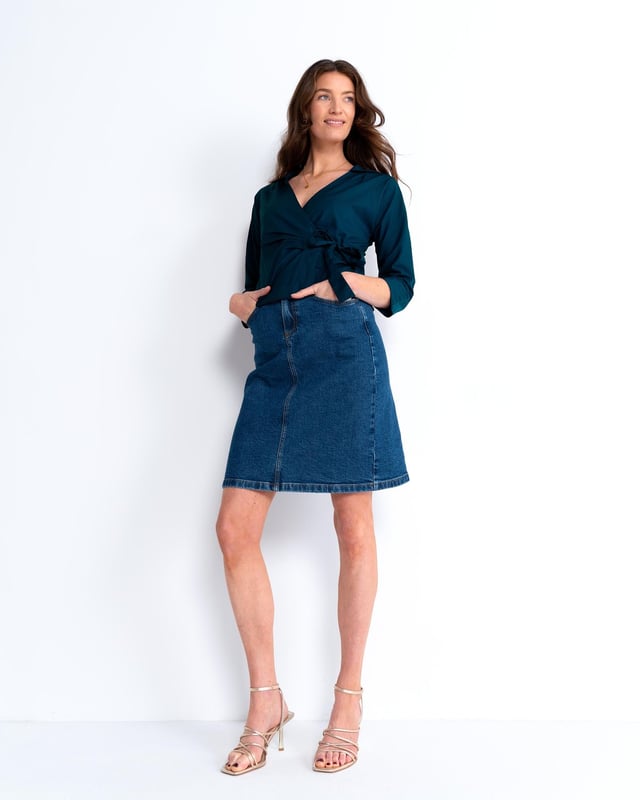 Embrace sophistication with this fitted wrap-style shirt, perfect for day-to-evening occasions. Featuring 3/4 length sleeves, pleated shoulders, cuffs, and adjustable side ties, it offers a flattering silhouette.