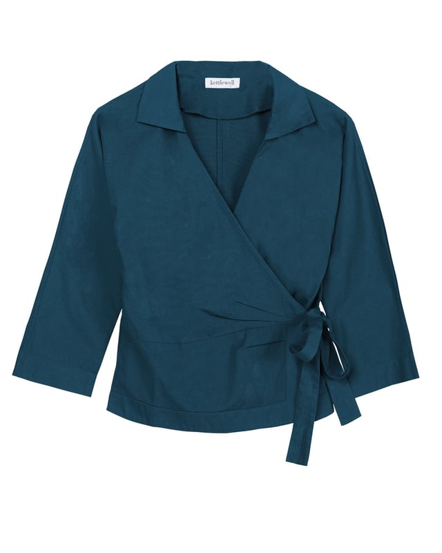 Embrace sophistication with this fitted wrap-style shirt, perfect for day-to-evening occasions. Featuring 3/4 length sleeves, pleated shoulders, cuffs, and adjustable side ties, it offers a flattering silhouette.