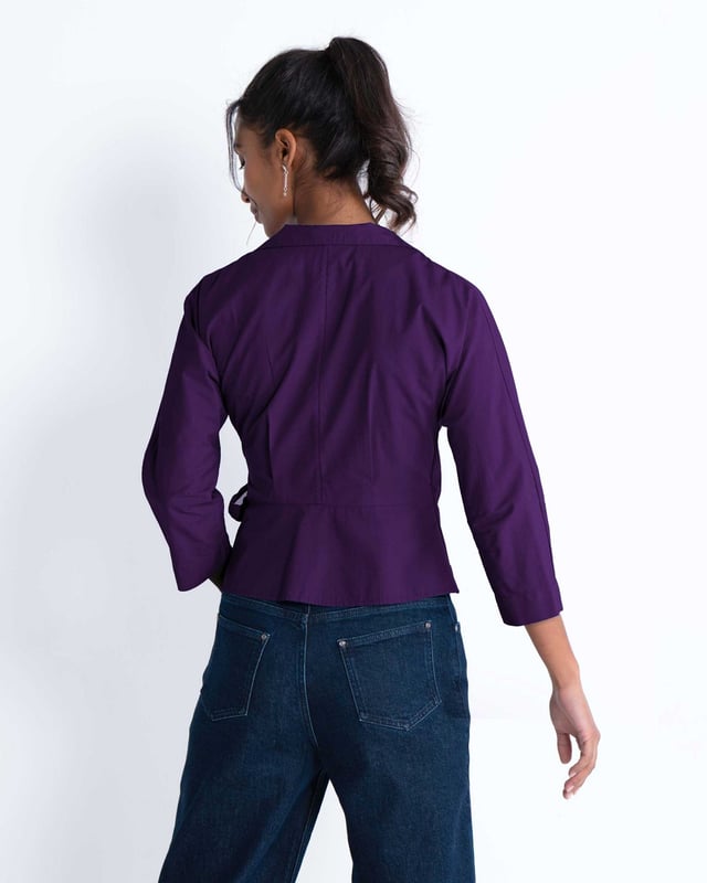Embrace sophistication with this fitted wrap-style shirt, perfect for day-to-evening occasions. Featuring 3/4 length sleeves, pleated shoulders, cuffs, and adjustable side ties, it offers a flattering silhouette.
