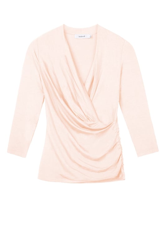 A timeless addition to every wardrobe, crafted from a luxurious fabric blend. This fitted top offers the same flattering silhouette as our popular Camille Crossover, shifted from print into versatile block colours.