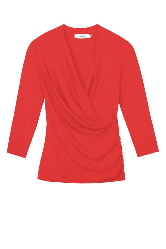 A timeless addition to every wardrobe, crafted from a luxurious fabric blend. This fitted top offers the same flattering silhouette as our popular Camille Crossover, shifted from print into versatile block colours.