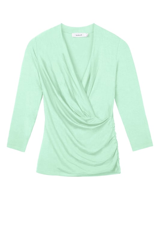 A timeless addition to every wardrobe, crafted from a luxurious fabric blend. This fitted top offers the same flattering silhouette as our popular Camille Crossover, shifted from print into versatile block colours.
