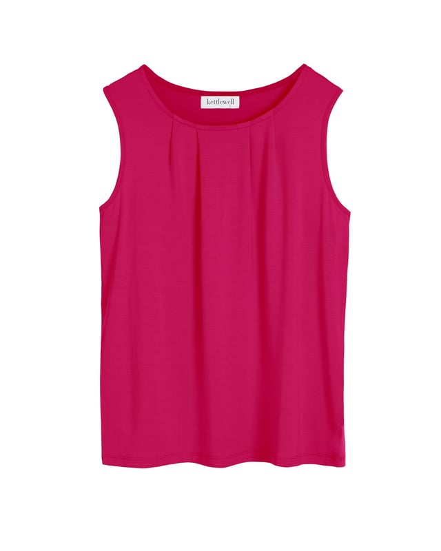 An update to a longstanding favourite in a new fit and fabric to add a breezy feel and an ever so slightly shorter length for ease of tucking in. Featuring delicate pleat detailing along the front neckline for a contemporary look under a jacket