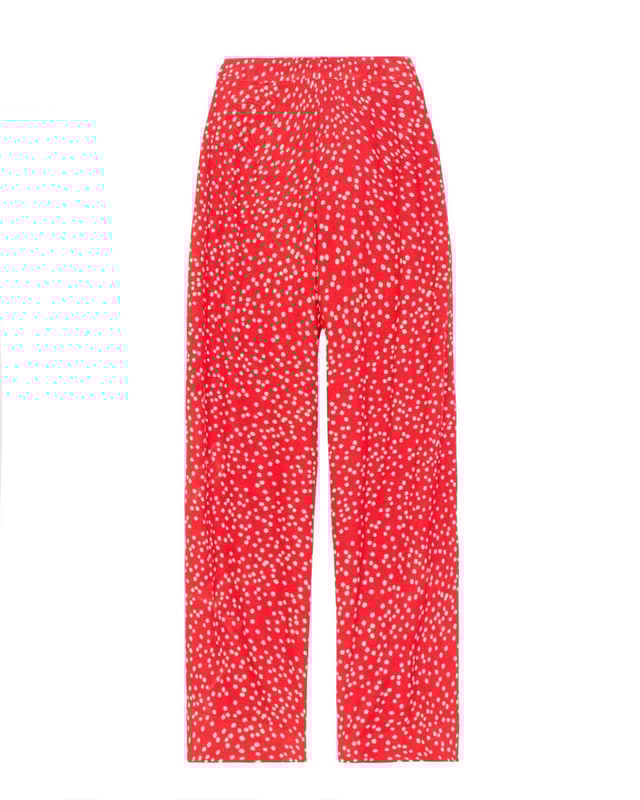 Joni Print Trousers Elevate your wardrobe with these versatile print trousers, perfect for transitioning from day to evening with effortless style. The wide-leg design, straight from thigh to hem, offers a flattering silhouette for all body types. A flat front waistband with a discreet back elastic panel ensures a comfortable, flexible fit. Part of the chic Joni Spot collection, these full-length trousers are an updated version of our popular Zoe Print design.