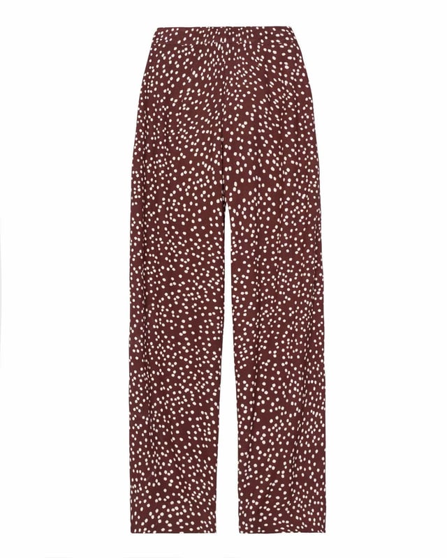 Elevate your wardrobe with these versatile print trousers, perfect for transitioning from day to evening with effortless style. The wide-leg design, straight from thigh to hem, offers a flattering silhouette for all body types. A flat front waistband with a discreet back elastic panel ensures a comfortable, flexible fit. Part of the chic Joni Spot collection, these full-length trousers are an updated version of our popular Zoe Print design.