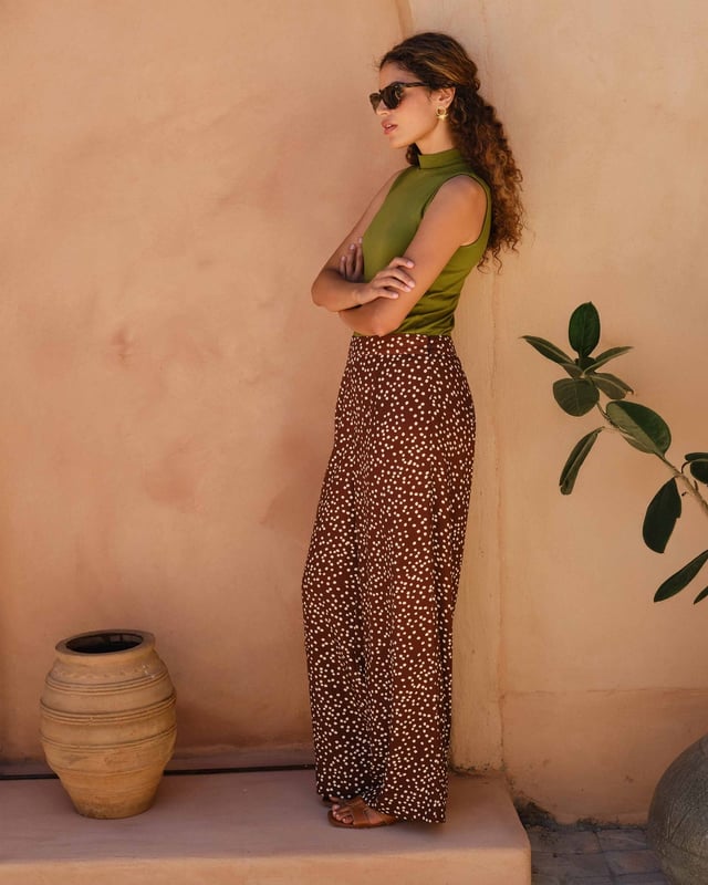 Elevate your wardrobe with these versatile print trousers, perfect for transitioning from day to evening with effortless style. The wide-leg design, straight from thigh to hem, offers a flattering silhouette for all body types. A flat front waistband with a discreet back elastic panel ensures a comfortable, flexible fit. Part of the chic Joni Spot collection, these full-length trousers are an updated version of our popular Zoe Print design.