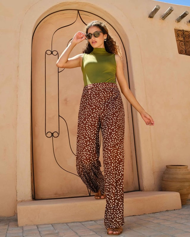 Elevate your wardrobe with these versatile print trousers, perfect for transitioning from day to evening with effortless style. The wide-leg design, straight from thigh to hem, offers a flattering silhouette for all body types. A flat front waistband with a discreet back elastic panel ensures a comfortable, flexible fit. Part of the chic Joni Spot collection, these full-length trousers are an updated version of our popular Zoe Print design.