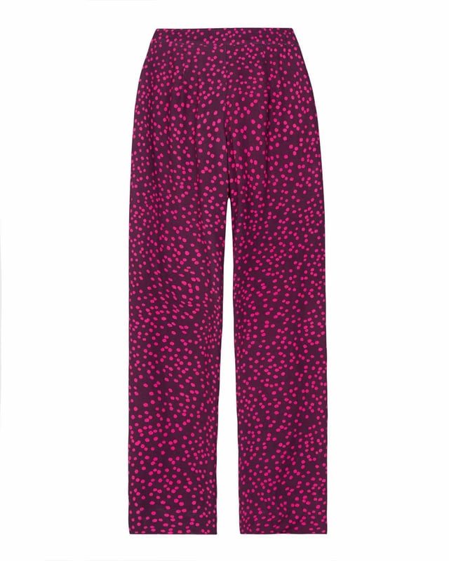 Joni Print Trousers Elevate your wardrobe with these versatile print trousers, perfect for transitioning from day to evening with effortless style. The wide-leg design, straight from thigh to hem, offers a flattering silhouette for all body types. A flat front waistband with a discreet back elastic panel ensures a comfortable, flexible fit. Part of the chic Joni Spot collection, these full-length trousers are an updated version of our popular Zoe Print design.