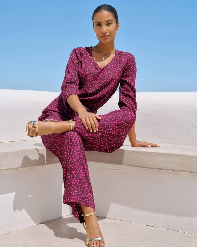 Joni Print Trousers Elevate your wardrobe with these versatile print trousers, perfect for transitioning from day to evening with effortless style. The wide-leg design, straight from thigh to hem, offers a flattering silhouette for all body types. A flat front waistband with a discreet back elastic panel ensures a comfortable, flexible fit. Part of the chic Joni Spot collection, these full-length trousers are an updated version of our popular Zoe Print design.