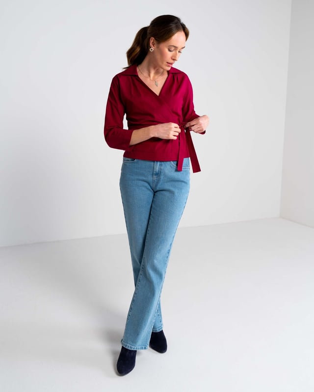 Embrace sophistication with this fitted wrap-style shirt, perfect for day-to-evening occasions. Featuring 3/4 length sleeves, pleated shoulders, cuffs, and adjustable side ties, it offers a flattering silhouette.