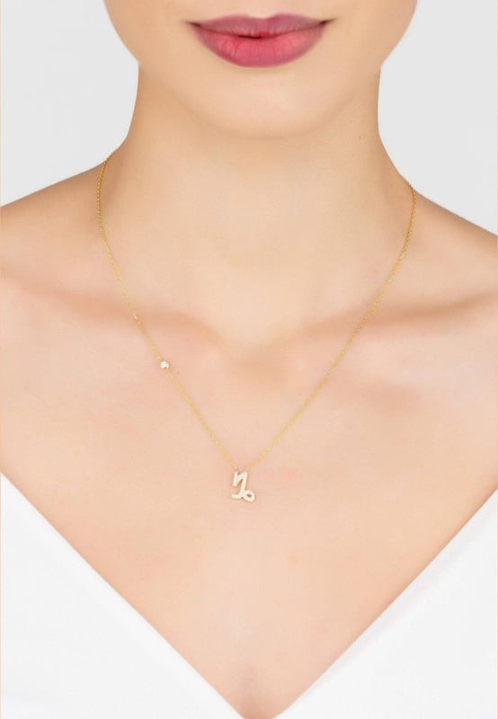 Made of 925 sterling silver, dipped in 22ct gold. This necklace is hand set with multifaceted white zircons.Capricorns celebrate birthdays December 22 - January 19Finished with a lobster clasp, and size adjusterDimensions: Necklace can be worn 40cm chain length or 45cm chain length using adjuster. Motif 1.5cm x 1cmPackaging:This item is presented in a Latelita London signature packagingCare Instructions:To maintain your jewellery, wipe gently with a damp cloth that is soft and clean. Do not soak in water. Avoid contact with soaps, detergents, perfume or hair spray
