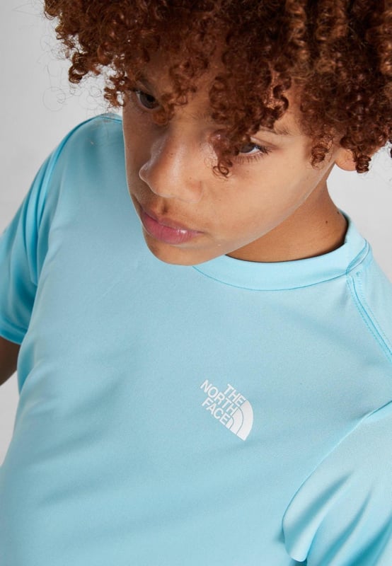 The North Face Reaxion T-Shirt Junior Boys in Atomizer Blue Upgrade your 'fits with this junior' Reaxion T-Shirt by The North Face. - - . This regular-fit tee is made with a lightweight and breathable poly fabric for easy wear. - -. It features sweat-wicking FlashDry tech for a cool feel, and a crew neckline with short sleeves for a classic cut. - - . Finished up with TNF branding to the chest and reverse shoulder. - -. Machine washable. Size Small Chest pit to pit 38 cms, length 54 cms. - -. Size Medium Chest pit to pit 40 cms, length 55 cms. - -. Size Large Chest pit to pit 42 cms, length 58 cms. - -. Size X-Large Chest pit to pit 46 cms, length 64 cms. - -. Size 2XLChest pit to pit 50 cms, length 71 cms. - -.