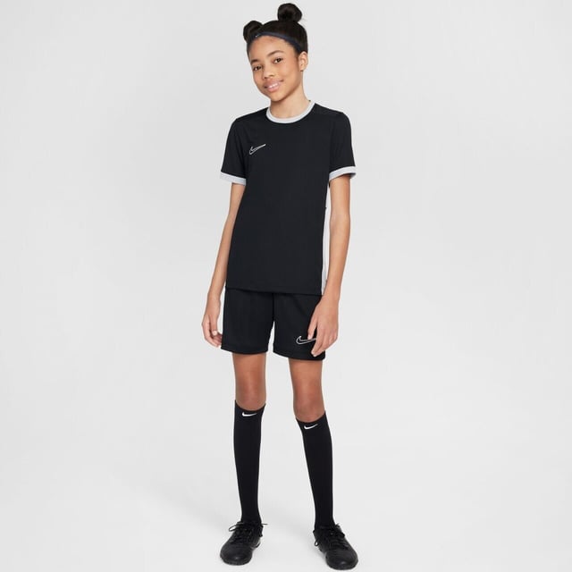 Elevate your game with the Nike Academy 25 Junior Short Sleeve Top—a must-have for aspiring athletes and seasoned players alike. Imagine stepping onto the field, feeling cool confidence wash over you as you gear up for your training routine or next big match. This top incorporates advanced Nike Dri-FIT technology to whisk away sweat, ensuring you remain dry and comfortable even during the most intense drills. With mesh panels strategically placed on the back and sides, enjoy optimal airflow that keeps you cool and focused on the task at hand. This top promises durability and performance.RRP: £17.00But functionality doesn’t mean you have to sacrifice style. Available in a spectrum of nine striking colours, the Nike Academy 25 allows you and your team to express your individual spirit and unity. Whether you're coordinating with your team or standing out with your unique flair, this top is your ticket to making a bold statement on the field. Get ready to redefine what it means to train hard and look great—because with the right gear, greatness is only a match away.FeaturesNike Dri-FIT technology moves sweat away from your skin for quicker evaporation, helping you stay dry and comfortable.Mesh on the back and sides lets air flow to help keep you cool.100% POLYESTERFZ9758