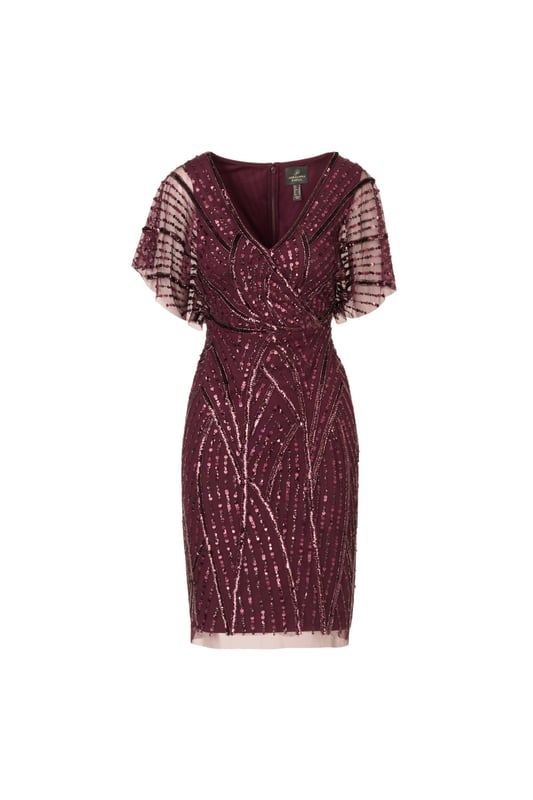 Brilliant beading brings this timeless dress to life. This beaded dress features a surplice bodice with v-neckline, sheer dolman sleeves, and a fitted skirt. Designed with a soft knit mesh fabric, this dress is embellished all over with figure-flattering patterns of sequins and beading. A zipper closure at the centre back completes this short sleeve dress. A stunning choice for elegant cocktail parties or formal weddings, this beaded dress is easy to accessorize with neutral heels and crystal jewellery.