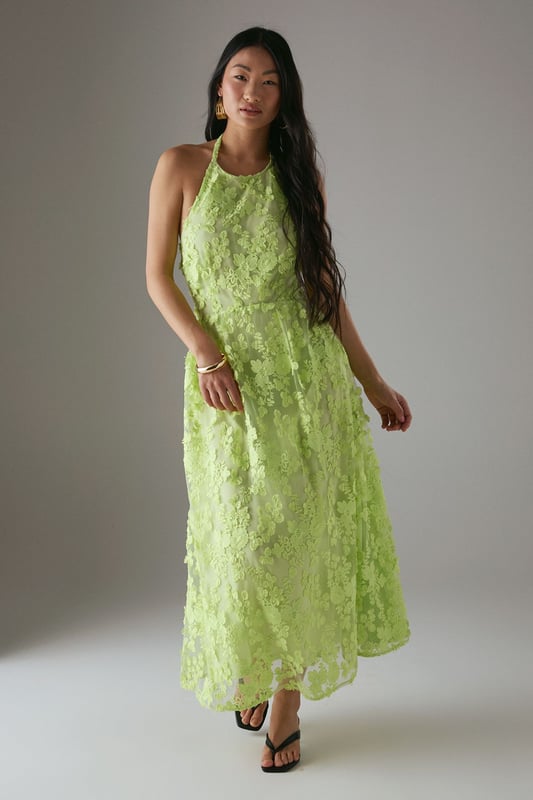 Stunning 3D floral embroidery creates a textured, dimensional effect across the entire dress
        Elegant halterneck design with tie fastening at the nape for a secure fit
        Dramatic open back detail adds a sultry touch to this feminine silhouette
        Midi length offers a flattering profile that works beautifully for special occasions
        Fully lined for comfort and a smooth drape against the skin
    
    Make a statement at your next special event with this exquisitely detailed halterneck midi dress from Warehouse. The showstopping 3D embroidered design creates beautiful texture and dimension that catches the light as you move. The halterneck silhouette frames the dcolletage perfectly, whilst the open back adds a touch of drama and sophistication. Style with strappy heeled sandals as seen on our model, and add statement earrings to complement the dress's intricate detailing. Perfect for summer weddings, garden parties or race day events, this dress can be dressed up with a tailored blazer for more formal occasions or worn as is to showcase the beautiful back detail. The petite cut ensures the proportions are perfectly balanced for a smaller frame.
