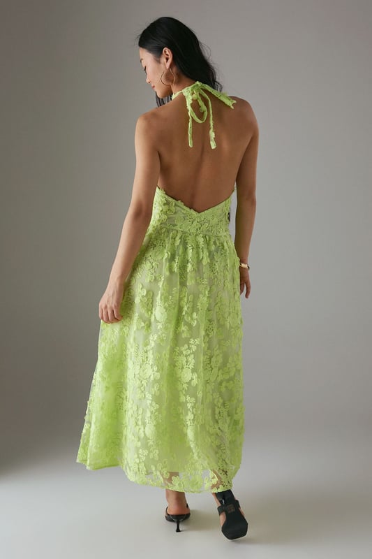 Stunning 3D floral embroidery creates a textured, dimensional effect across the entire dress
        Elegant halterneck design with tie fastening at the nape for a secure fit
        Dramatic open back detail adds a sultry touch to this feminine silhouette
        Midi length offers a flattering profile that works beautifully for special occasions
        Fully lined for comfort and a smooth drape against the skin
    
    Make a statement at your next special event with this exquisitely detailed halterneck midi dress from Warehouse. The showstopping 3D embroidered design creates beautiful texture and dimension that catches the light as you move. The halterneck silhouette frames the dcolletage perfectly, whilst the open back adds a touch of drama and sophistication. Style with strappy heeled sandals as seen on our model, and add statement earrings to complement the dress's intricate detailing. Perfect for summer weddings, garden parties or race day events, this dress can be dressed up with a tailored blazer for more formal occasions or worn as is to showcase the beautiful back detail. The petite cut ensures the proportions are perfectly balanced for a smaller frame.