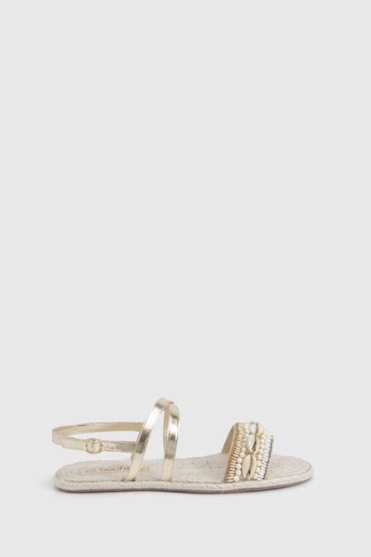 Wide fit espadrilles with eye-catching sequin embellishment across the front strap
        Comfortable flat heel measuring between 0-2cm for all-day wear
        Adjustable ankle strap with buckle fastening for a secure fit
        Traditional rope-style sole adds authentic espadrille character
        Metallic straps create a versatile, statement finish perfect for summer styling
    
    These wide fit espadrilles blend comfort with captivating style, making them the perfect companion for your summer wardrobe. The sequin-detailed front strap catches the light beautifully, whilst the metallic straps add a touch of glamour to casual outfits. Style with a flowing maxi dress and straw hat for beachside strolls, or pair with cropped linen trousers and a simple tee for weekend brunches. The adjustable ankle strap ensures these sandals stay securely in place, whilst the traditional espadrille base provides that quintessential holiday feel. Ideal for family gatherings, city explorations or garden parties, these versatile flats offer both comfort and style without compromising on either. The wide fit design ensures all-day comfort, making these the sandals you'll reach for throughout the warmer months.