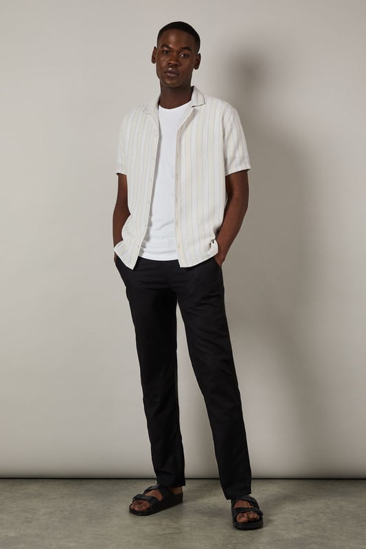 Textured stripe pattern adds subtle dimension to this classic short sleeve shirt
        Revere collar design offers a relaxed, open neckline perfect for warmer days
        Button-through front with clean finishing for effortless style
        Relaxed fit through the body provides comfortable all-day wear
        Versatile woven fabric with textural interest that maintains its shape throughout the day
    
    This Burton textured stripe shirt brings casual sophistication to your everyday wardrobe. The revere collar creates a laid-back yet put-together look that works brilliantly for various occasions. Style it as shown with dark trousers and a simple white t-shirt underneath for an effortless weekend ensemble, perfect for meeting mates at the pub or casual family gatherings. The textured stripe pattern adds character without overwhelming, making this shirt an excellent choice for summer barbecues or watching the match. For a smarter approach, pair with chinos and loafers. The versatile design transitions seamlessly from daytime casual to evening drinks, embodying Burton's commitment to practical yet stylish menswear that fits comfortably into the modern British man's lifestyle.