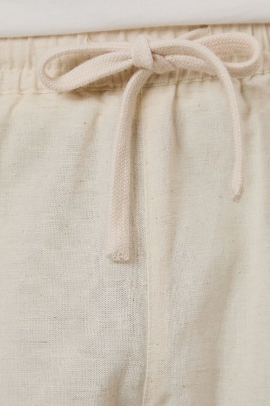 Crafted from a linen blend fabric for breathable comfort in warmer weather
        Relaxed fit with mid-thigh length for easy movement and versatile styling
        Practical side pockets for essentials
        Drawstring waistband for adjustable comfort
        Versatile design that pairs effortlessly with both casual and smart-casual attire
    
    These Burton linen blend shorts offer the perfect balance of comfort and style for the modern man. The breathable fabric makes them ideal for warm weather, whether you're enjoying a weekend barbecue or heading to the beer garden with mates. Style them as shown with a matching shirt for a coordinated summer look, or pair with a simple t-shirt for more casual occasions. The relaxed silhouette and practical pockets make these shorts a practical choice for family gatherings, sporting events, or casual Friday at the office. Machine washable at 30 degrees, they're designed with everyday practicality in mind. These shorts will quickly become your go-to for summer weekends, holiday packing, and casual outings where comfort meets laid-back style.