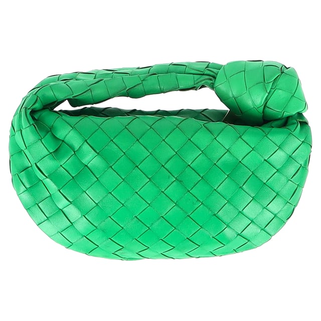 VINTAGE, RRP AS NEW
Elevate your accessory game with the Bottega Veneta Mini Jodie in Green Intrecciato Leather. This iconic bag is a true statement piece that exudes luxury and sophistication. The intricate woven leather detailing in a rich green hue adds a pop of artisanal elegance to any outfit. Whether paired with a casual daytime look or a chic evening ensemble, this mini bag is the epitome of refined style. Its compact size makes it perfect for carrying your essentials while maintaining an effortlessly elegant silhouette. Pair it with a neutral-toned tailored jumpsuit for a contemporary and polished look that seamlessly transitions from day to night.

Bottega Veneta Mini Jodie in Green Intrecciato Leather
Condition: Good
Signs of wear: Some black marks on exterior and interior surface
Packaging: Dust bag
Color: Green 
Material: Leather | leather
Size: One Size | One Size
Measurements: Width: 50; Height: 130; Length: 260; Handle drop: 50; Strap length: 0
SKU: NAPPUGBBA424692W
