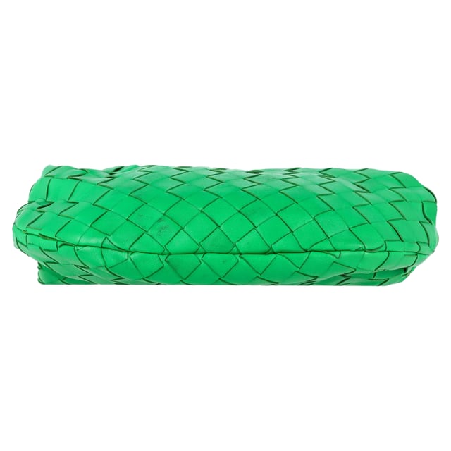 VINTAGE, RRP AS NEW
Elevate your accessory game with the Bottega Veneta Mini Jodie in Green Intrecciato Leather. This iconic bag is a true statement piece that exudes luxury and sophistication. The intricate woven leather detailing in a rich green hue adds a pop of artisanal elegance to any outfit. Whether paired with a casual daytime look or a chic evening ensemble, this mini bag is the epitome of refined style. Its compact size makes it perfect for carrying your essentials while maintaining an effortlessly elegant silhouette. Pair it with a neutral-toned tailored jumpsuit for a contemporary and polished look that seamlessly transitions from day to night.

Bottega Veneta Mini Jodie in Green Intrecciato Leather
Condition: Good
Signs of wear: Some black marks on exterior and interior surface
Packaging: Dust bag
Color: Green 
Material: Leather | leather
Size: One Size | One Size
Measurements: Width: 50; Height: 130; Length: 260; Handle drop: 50; Strap length: 0
SKU: NAPPUGBBA424692W