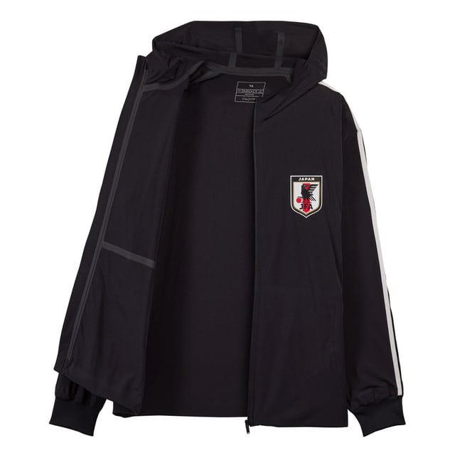 Men's Y-3 JFA Anthem Jacket in Black Mens Y-3 JFA Anthem Jacket in blackY-3 and the Japanese Football Association have collaborated to create unique on-pitch styles worn by JFA during the world's most iconic athletic event. The celebrated jacket that JFA players wear standing side-by-side on the pitch has now been elevated through a Y-3 lens. In collaboration with the Japanese Football Association the Y-3 JFA Anthem Jacket pairs classic sport design with Y-3's masterful eye for detail. The 3-Stripes are seen on one arm only and a JFA crest and Y-3 logo accent the look. AEROREADY manages moisture to keep you dry and feeling confident.This product is made with at least 70% recycled materials. By reusing materials that have already been created we help to reduce waste and our reliance on finite resources and reduce the footprint of the products we make.- A jacket from Y-3 and the Japanese Football Association made in part with recycled materials.- Relaxed fit- Zip front- 83% polyamide (recycled) 17% elastane- AEROREADY- Ribbed cuffs- Y-3 logo and Japan Football Association crest heat transfers- Zip front pockets- Contains at least 70% recycled content- Machine wash cold mild delicate cycle- Ref: IW7385